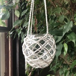 Crocheted hanging glass bowl